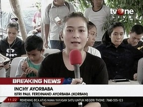 In this image from video, Inchy Ayorbaba, wife of missing passenger Paul Ferdinand Ayorbaba, speaks in a TV interview in Jakarta on Wednesday, Oct. 31, 2018.