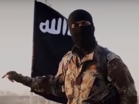 A Canadian ISIS prisoner says that this man, a possible executioner, is also Canadian.