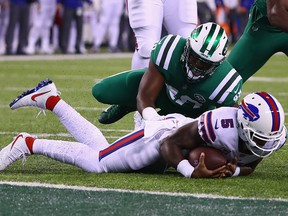 Quarterback Tyrod Taylor of the Buffalo Bills is sacked by outside linebacker Jordan Jenkins of the New York Jets during the first quarter of the game at MetLife Stadium on Nov. 2, 2017 in East Rutherford, N.J.