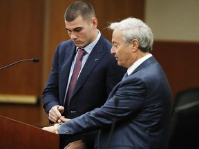 Denver Broncos backup quarterback Chad Kelly, left, and his attorney Harvey Steinberg appear for a hearing in the Arapahoe County Courthouse, Wednesday, Oct. 24, 2018, in Centennial, Colo.  (AP Photo/David Zalubowski, Pool)