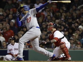 Los Angeles Dodgers' Matt Kemp hits an RBI sacrifice fly during the fourth inning of Game 2 of the World Series against the Boston Red Sox on Wednesday. (Matt Slocum/The Associated Press)
