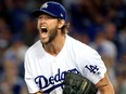 Clayton Kershaw of the Los Angeles Dodgers celebrates after retiring the side in the eighth inning against the Atlanta Braves during Game Two of the National League Division Series at Dodger Stadium on Oct. 5, 2018 in Los Angeles.