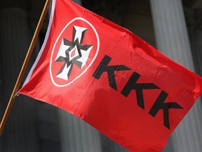 A Ku Klux Klan flag flies during a demonstration at the state house building on July 18, 2015 in Columbia, South Carolina. (John Moore/Getty Images)