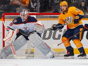 Viktor Arvidsson of the Nashville Predators gets in position in front of goalie Mikko Koskinen of the Edmonton Oilers during the second period at Bridgestone Arena on October 27, 2018 in Nashville, Tennessee.