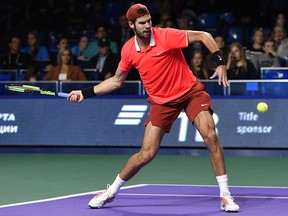 Russia's Karen Khachanov returns a ball to France's Adrian Mannarino during the Kremlin Cup tennis tournament men's singles final match in Moscow on Oct. 21, 2018.