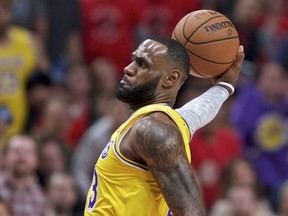 Los Angeles Lakers forward LeBron James dunks against the Portland Trail Blazers during the first half of an NBA basketball game in Portland, Ore., Thursday, Oct. 18, 2018.