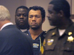 In a Tuesday, Jan. 15, 2008 file photo, Lam Luong is escorted into Mobile County District Court Judge Charles McKnight's court room at Mobile Government Plaza in Mobile, Ala. (Bill Starling/Press-Register via AP)