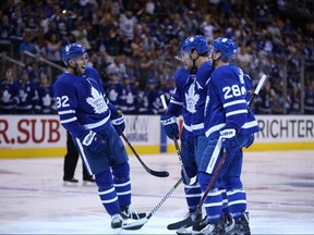 Maple Leafs’ Josh Leivo (left) celebrates during a preseason game against the Buffalo Sabres on Sept. 21, 2018.
