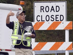 A drone operator with the National Transportation Safety Board conducts an investigation at the scene of Saturday's fatal limousine crash in Schoharie, N.Y., Monday, Oct. 8, 2018. (AP Photo/Hans Pennink)