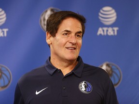 In this Feb. 26, 2018, file photo, Dallas Mavericks owner Mark Cuban stands on stage before an NBA basketball press conference in Dallas. (AP Photo/Ron Jenkins, File)
