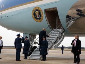President Donald Trump boards Air Force One as he heads for a campaign rally in Charlotte, N.C., Friday, Oct. 26, 2018, in Andrews Air Force Base, Md.