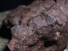 A Michigan man recently learned that a rock he's been using as a doorstop is a meteorite worth $100,000. (Central Michigan University/YouTube)