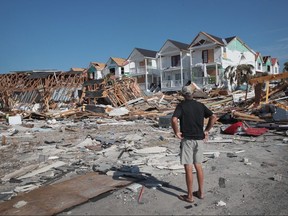James Whiddon looks over damage caused by Hurricane Michael on Friday, Oct. 19, 2018 in Mexico Beach, Florida.