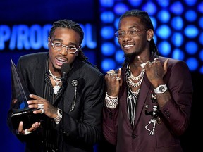 Quavo (L) and Offset of Migos accept Favorite Duo or Group - Pop/Rock onstage during the 2018 American Music Awards at Microsoft Theater on Oct. 9, 2018 in Los Angeles.