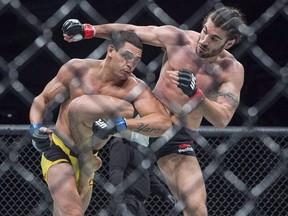 Elias Theodorou, right, from Mississauga, Ont. battles Cezar Ferreira from Brazil in a middleweight bout at UFC Fight Night in Halifax on February 19, 2017.