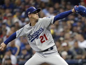 Dodgers starting pitcher Walker Buehler throws during first inning of Game 7 of the National League Championship Series against the Brewers Saturday, Oct. 20, 2018, in Milwaukee.