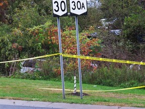 In this Oct. 6, 2018, file photo, a limousine, left, has landed in the woods following a fatal crash in Schoharie, N.Y.