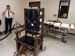 In this Oct. 13, 1999, file photo, Ricky Bell, the warden at Riverbend Maximum Security Institution in Nashville, Tenn., gives a tour of the prison's execution chamber. (AP Photo/Mark Humphrey, File)