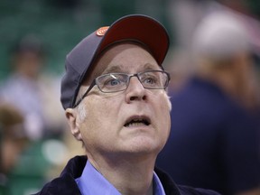 FILE - In this Oct. 12, 2015 file photo, Portland Trail Blazers owner Paul Allen looks on before the start of the first quarter of an NBA preseason basketball game against the Utah Jazz in Salt Lake City. Allen, billionaire owner of the Trail Blazers and the Seattle Seahawks and Microsoft co-founder, died Monday, Oct. 15, 2018 at age 65. Earlier this month Allen said the cancer he was treated for in 2009, non-Hodgkin's lymphoma, had returned.