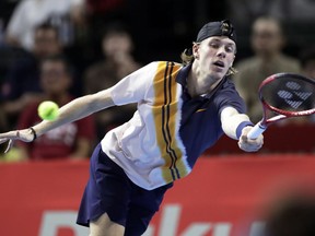 Denis Shapovalov of Canada returns a shot against Daniil Medvedev of Russia during their singles semifinal match at the Japan Open men's tennis tournament in Tokyo, Saturday, Oct. 6, 2018.
