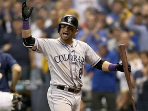 Gerardo Parra of the Colorado Rockies reacts after striking out during the sixth inning of Game Two of the National League Division Series against the Milwaukee Brewers at Miller Park on Oct. 5, 2018 in Milwaukee, Wis.