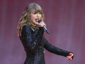 In this June 22, 2018, file photo, singer Taylor Swift performs on stage in concert at Wembley Stadium in London. Swift  posted on Instagram Sunday, Oct. 7, that she's voting for Tennessee's Democratic Senate candidate Phil Bredesen, breaking her long-standing refusal to discuss anything politics.