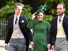 Pippa Middleton, centre, 
 attends the wedding of Princess Eugenie of York to Jack Brooksbank with her husband James Matthews, left, and brother James Middleton at St. George's Chapel on October 12, 2018 in Windsor, England. (Mark Large - WPA Pool/Getty Images)