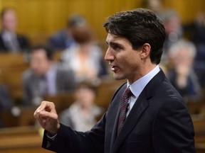 Prime Minister Justin Trudeau stands in the House of Commons during question period on Parliament Hill in Ottawa on Wednesday, Oct. 3, 2018.