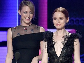 Lili Reinhart (L) and Madelaine Petsch walk onstage during the 2017 American Music Awards at Microsoft Theater on Nov. 19, 2017 in Los Angeles.
