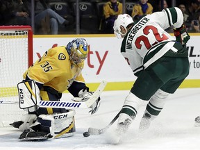 Nashville Predators goaltender Pekka Rinne (35) blocks a shot by Minnesota Wild right wing Nino Niederreiter Monday, Oct. 15, 2018, in Nashville, Tenn. (AP Photo/Mark Humphrey)