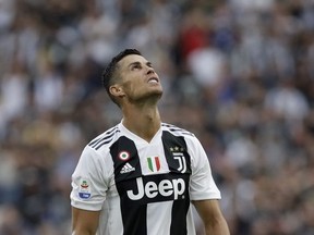FILE - In this Aug. 25, 2018 file photo Juventus' Cristiano Ronaldo looks to the sky as he reacts during the Serie A soccer match between Juventus and Lazio at the Allianz Stadium in Turin, Italy. Ronaldo is being sued by a Nevada woman who said he raped her in the penthouse suite of a Las Vegas hotel in 2009 and then dispatched a team of "fixers" to obstruct the criminal investigation and trick her into keeping quiet for $375,000. The suit filed Thursday asks the Clark County District Court to void the 2010 settlement and non-disclosure agreement, claiming the woman was so traumatized by the events that she was incapable of participating in negotiations.