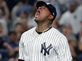 New York Yankees starting pitcher Luis Severino reacts after striking out Oakland Athletics' Marcus Semien with the bases loaded to end the top of the fourth inning of the American League wild-card playoff baseball game, Wednesday, Oct. 3, 2018, in New York.