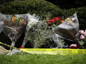 Flowers sit at a makeshift memorial at the Tree of Life Synagogue in Pittsburgh, Sunday, Oct. 28, 2018. Robert Bowers, the suspect in Saturday's mass shooting at the synagogue, expressed hatred of Jews during the rampage and told officers afterward that Jews were committing genocide and he wanted them all to die, according to charging documents made public Sunday.