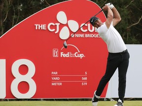 Brooks Koepka of the United States watches his shot on the 18th hole during the final round of the CJ Cup PGA golf tournament at Nine Bridges on Jeju Island, South Korea, Sunday, Oct. 21, 2018.