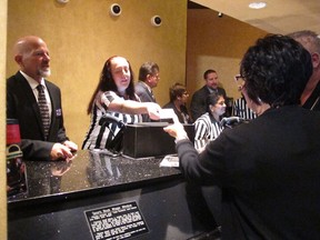 This Aug. 1, 2018 photo shows gamblers placing bets in the sports betting lounge at Harrah's casino in Atlantic City N.J.