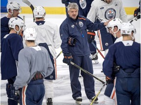 Edmonton Oilers' head coach Todd McLellan, center, talks to players during a training session in Gothenburg, Sweden, Friday Oct. 5, 2018. The New Jersey Devils will play the Edmonton Oilers in an NHL Global Tour hockey match on Saturday. (Bjorn Larsson Rosvall/TT News Agency via AP) ORG XMIT: LLT810
