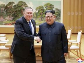 In this May 9, 2018, file photo provided by the North Korean government, U.S. Secretary of State Mike Pompeo, left, shakes hands with North Korean leader Kim Jong Un during a meeting at Workers' Party of Korea headquarters in Pyongyang, North Korea. (Korean Central News Agency/Korea News Service via AP, File)