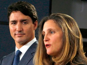Prime Minister Justin Trudeau (L) and Minister of Foreign Affairs Chrystia Freeland (R) speak at a press conference to announce the new USMCA trade pact between Canada, the United States, and Mexico in Ottawa, Oct. 1, 2018.