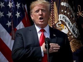 U.S. President Donald Trump sings the national anthem during an event on the south lawn of the White House June 5, 2018 in Washington, DC. (Win McNamee/Getty Images)