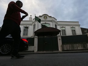 A man walks past Saudi Arabia's consul general's official residence in Istanbul, Wednesday, Oct. 24, 2018.