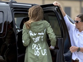 FILE - In this June 21, 2018, file photo, First lady Melania Trump arrives at Andrews Air Force Base, Md., wearing a jacket that reads "I REALLY DON'T CARE, DO U?" after visiting a children's center in McAllen, Texas. A Melania Trump spokeswoman is asking people to boycott Atlanta rapper T.I. because of his promotional album video that shows a woman resembling the first lady stripping in the oval office. WXIA-TV reports the director of communications for Melania Trump, Stephanie Grisham, tweeted Saturday asking how the video was acceptable.