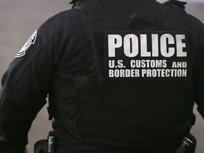 U.S. Customs and Border Protection officer is shown in the secondary inspection area on Wednesday, Oct. 17, 2018 in Windsor. (DAN JANISSE/THE WINDSOR STAR)