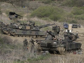 U.S. Army M1A2 tanks conduct a military exercise in Paju, near the border with North Korea, South Korea, Friday, April 21, 2017. (AP Photo/Ahn Young-joon)