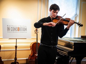 In this photo provided by Chris Lee, Juilliard student Nathan Meltzer, plays the instrument in New York on Tuesday, Oct. 9, 2018. (Chris Lee via AP)