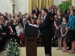 President Donald Trump, Chief Justice John Roberts, back left, and justices of the Supreme Court, listen to Justice Brett Kavanaugh speak during the ceremonial swearing-in ceremony of Kavanaugh as Associate Justice of the Supreme Court of the United States in the East Room of the White House in Washington, Monday, Oct. 8, 2018. Kavanaugh is accompanied by his wife Ashley Kavanaugh, third from left, and children Margaret, second from left, and Liza.
