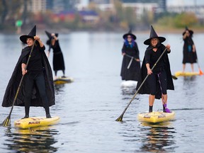 Hundreds of witches, along with a handful of warlocks and wizards, tossed their broomsticks, grabbed paddles and travelled six miles along the Willamette River Saturday, Oct. 27, 2018.