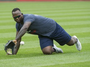 In this Aug. 30, 2018 file photo, Minnesota Twins' Miguel Sano warms up before a game, in Cleveland, Ohio.