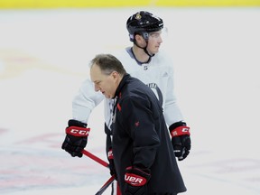 Ottawa Senators assistant coach Martin Raymond (left) and Senators forward Matt Duchene skate during practice on Tuesday. (THE CANADIAN PRESS)