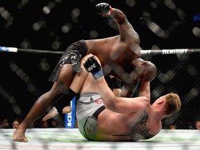Derrick Lewis (top) beats on Alexander Volkov of Russia to a knock out in their heavyweight bout during the UFC 229 event inside T-Mobile Arena on October 6, 2018 in Las Vegas, Nevada.