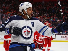 Dustin Byfuglien of the Winnipeg Jets celebrates his third period goal while paying the Detroit Red Wings at Little Caesars Arena on Oct.26, 2018 in Detroit, Mich.